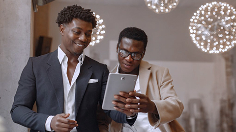 two men using tablet two men using tablet