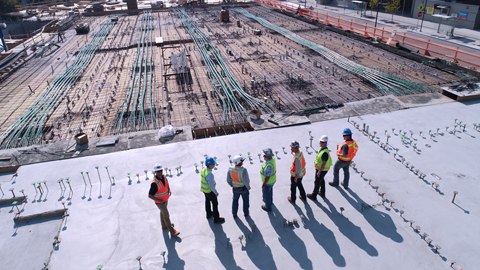 Engineers overlooking construction site