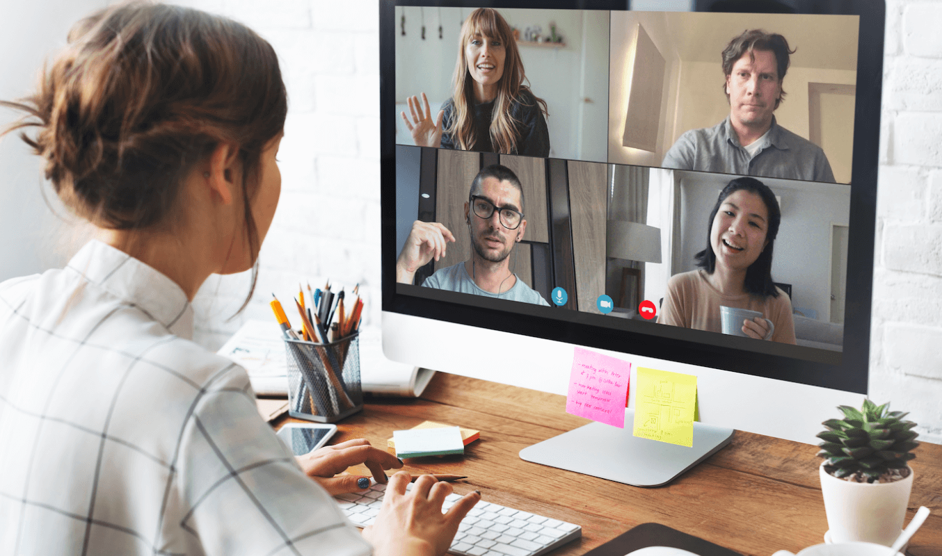 A female team member collaborating through a virtual meeting using a desktop