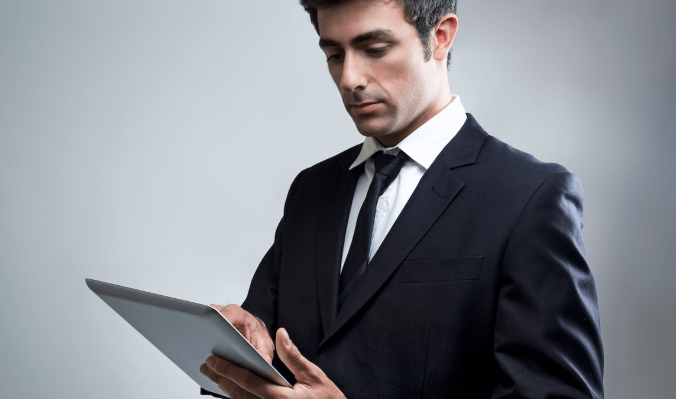 An executive navigating the meeting through a tablet