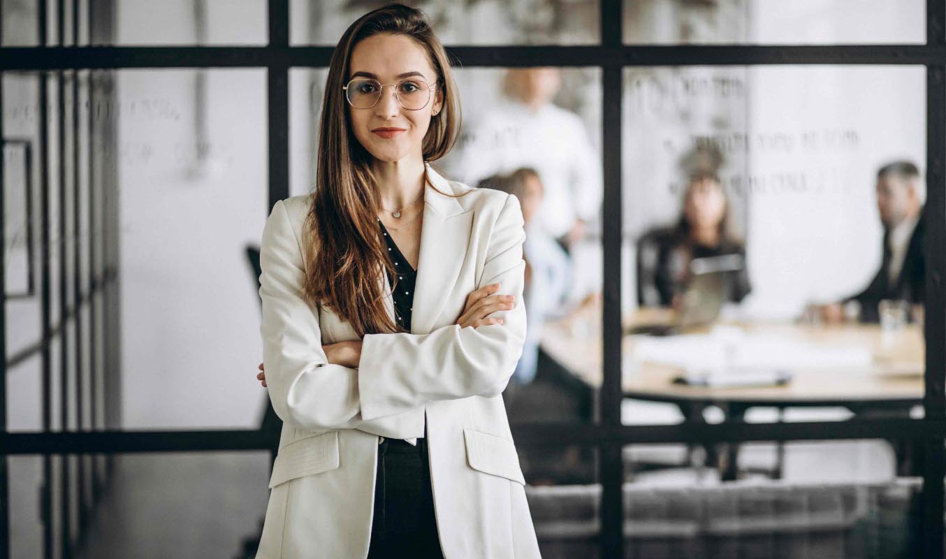 A female director standing to symbolize women empowerment and gender diversity on boards