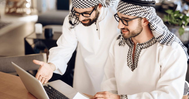 image 3 - 2 arabic men looking at the laptop