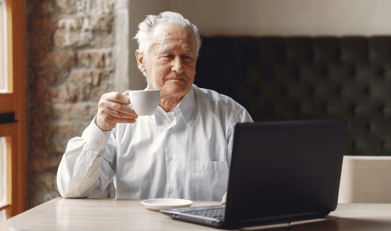 Man using laptop for pension funds